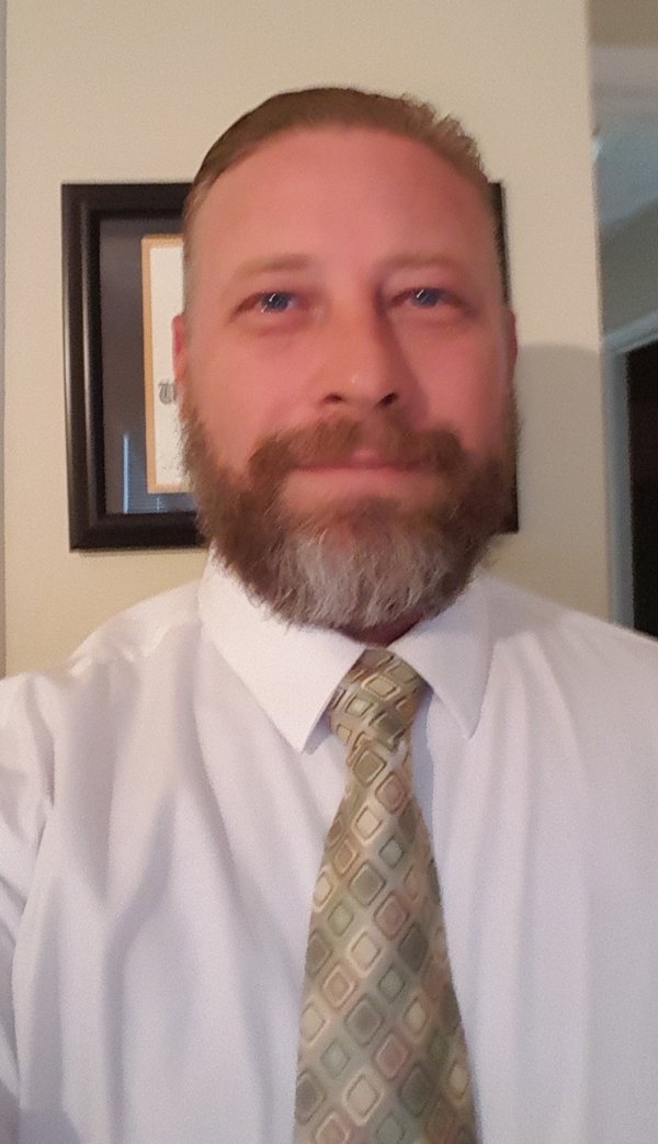 Robb Schrader in a shirt and tie